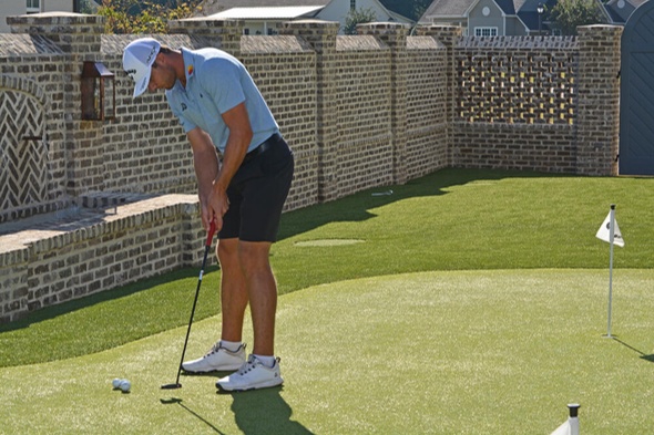 Austin Golfer putting on synthetic grass
